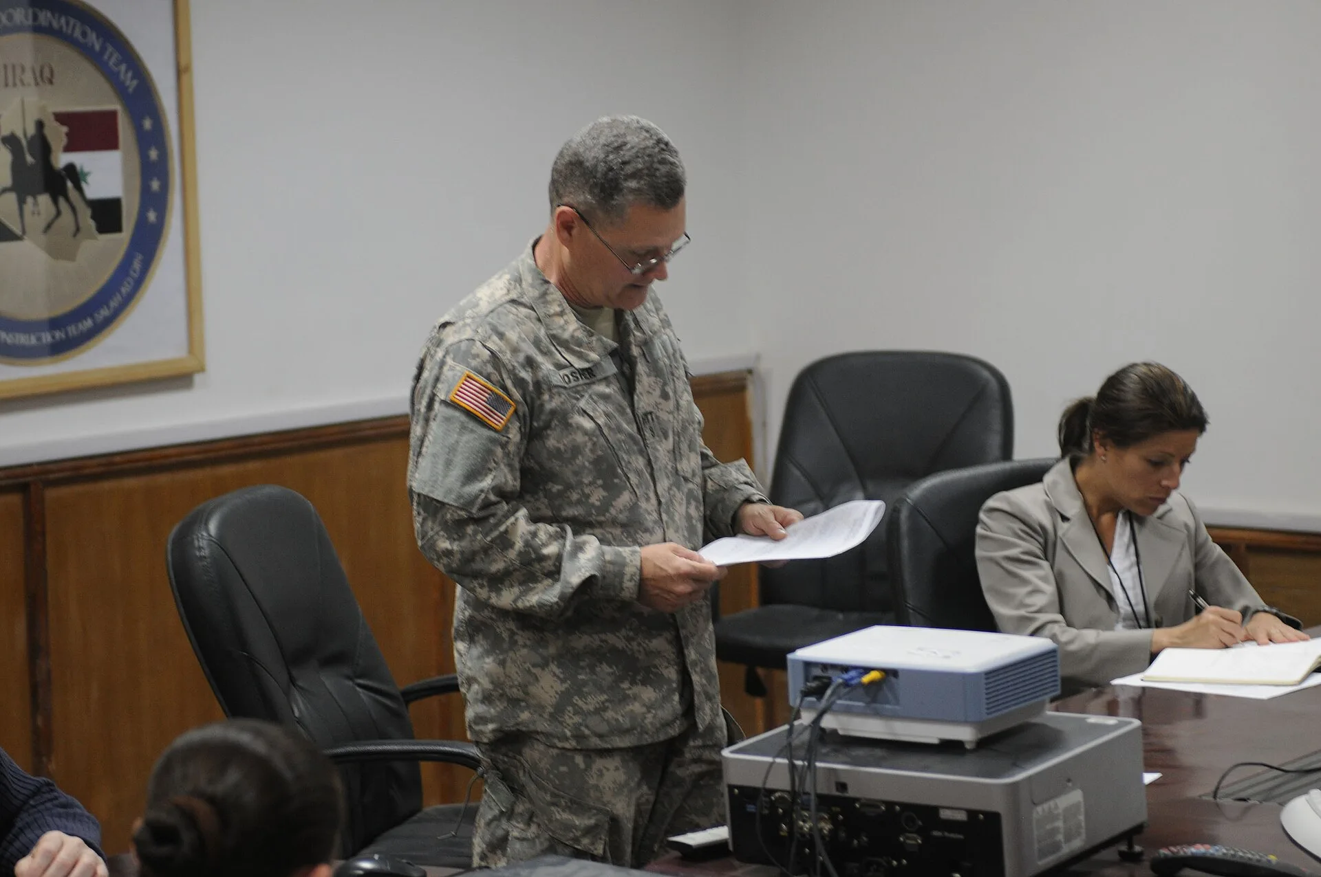 Alvin Mosher, team leader of Human Terrain System, reads out a plan of action to assess a village near the city of Samarra, Iraq, which mostly women and children occupy. The meeting is held in Contingency Operating Base Speicher, Tikrit, Iraq, on April 20, 2009. Leadership influence mistakes worth avoiding early