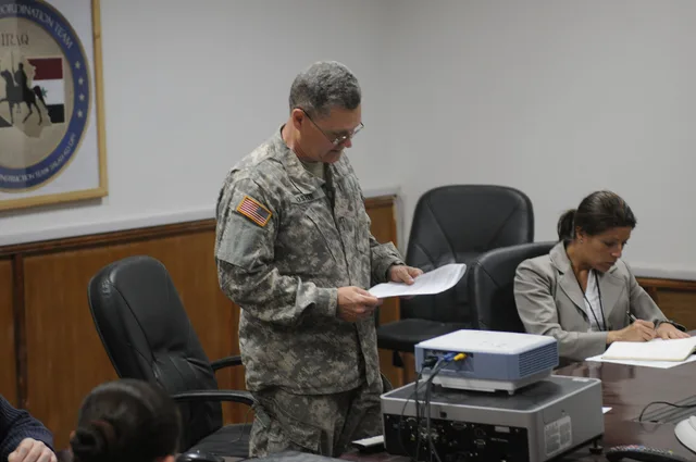 Alvin Mosher, team leader of Human Terrain System, reads out a plan of action to assess a village near the city of Samarra, Iraq, which mostly women and children occupy. The meeting is held in Contingency Operating Base Speicher, Tikrit, Iraq, on April 20, 2009. Leadership influence mistakes worth avoiding early